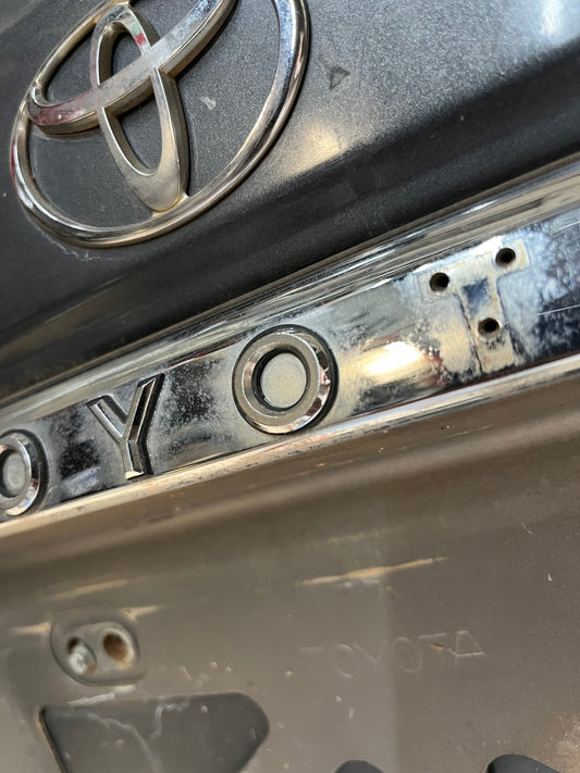 Used OEM Rear License "O" Emblem - Toyota 4Runner - 1989-1995